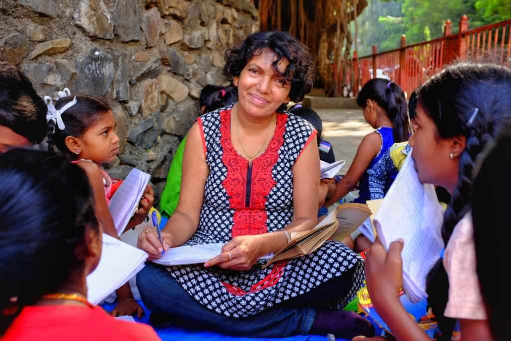 Happy teacher with her students