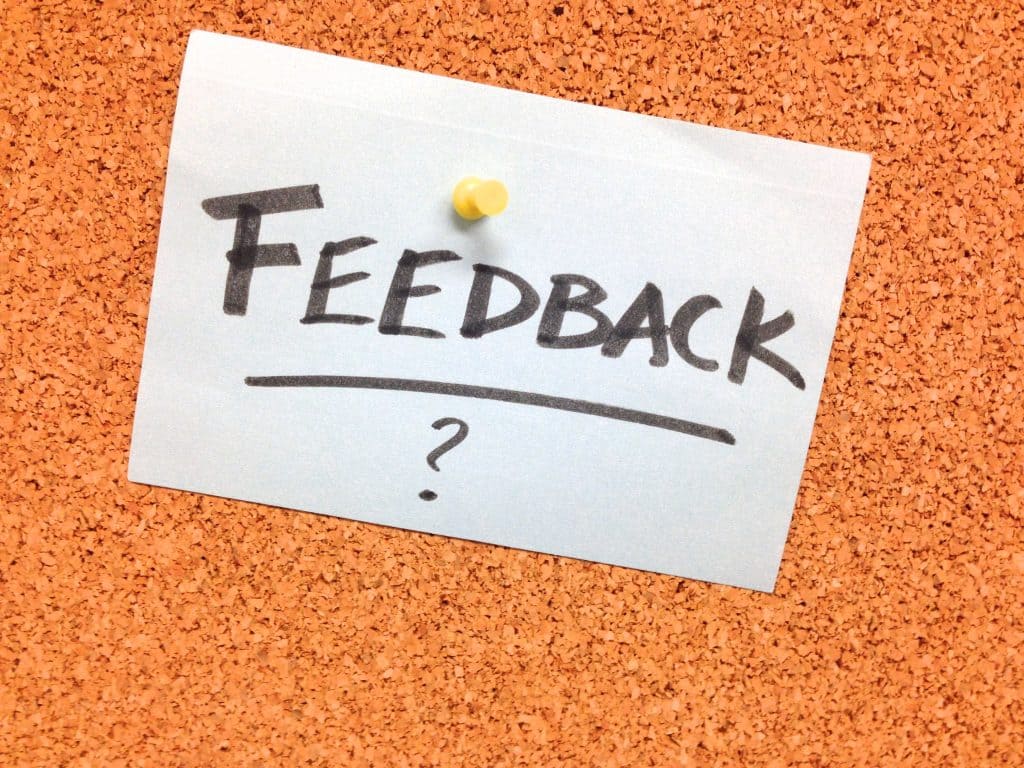 The word feedback written on a piece of paper. 