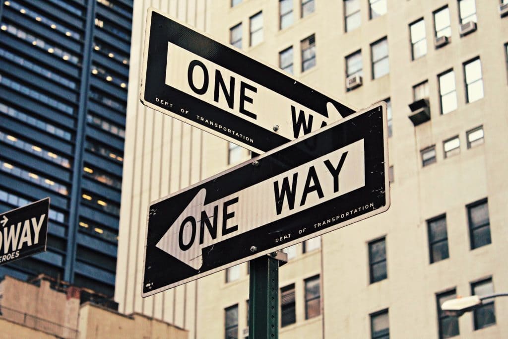 Street sign board saying one way. 