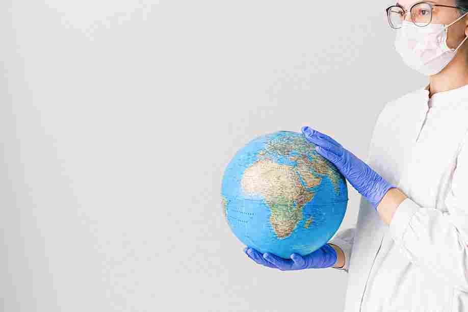 nurse holding a globe