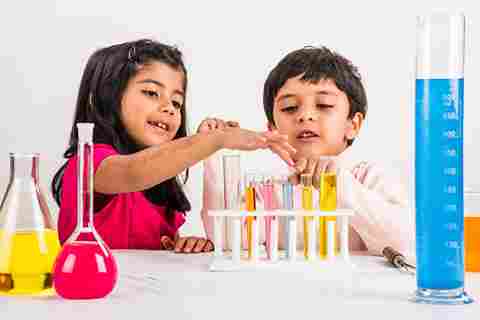children fixing chemical tubes
