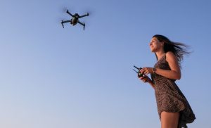 girl flying a drone