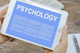 a person holding a tab with the word 'psychology' on it