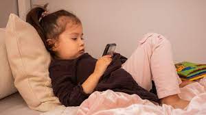 toddler using a smartphone