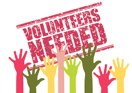 Volunteers needed sign with hands up: A sign requesting volunteers, with hands raised in support, symbolizing unity and willingness to help.
