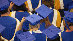 college students wearing blue graduation hats and uniform